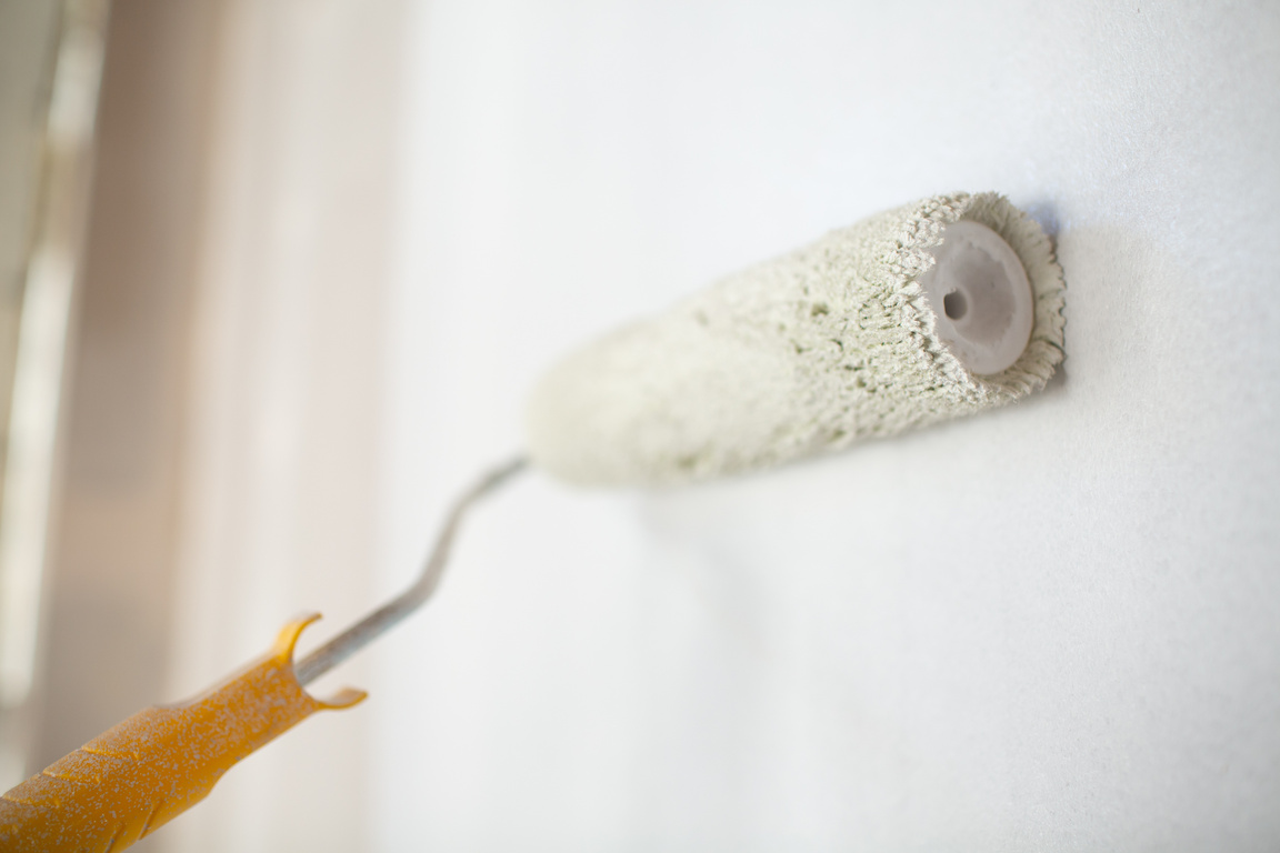 Painting a Wall with Roller Brush 